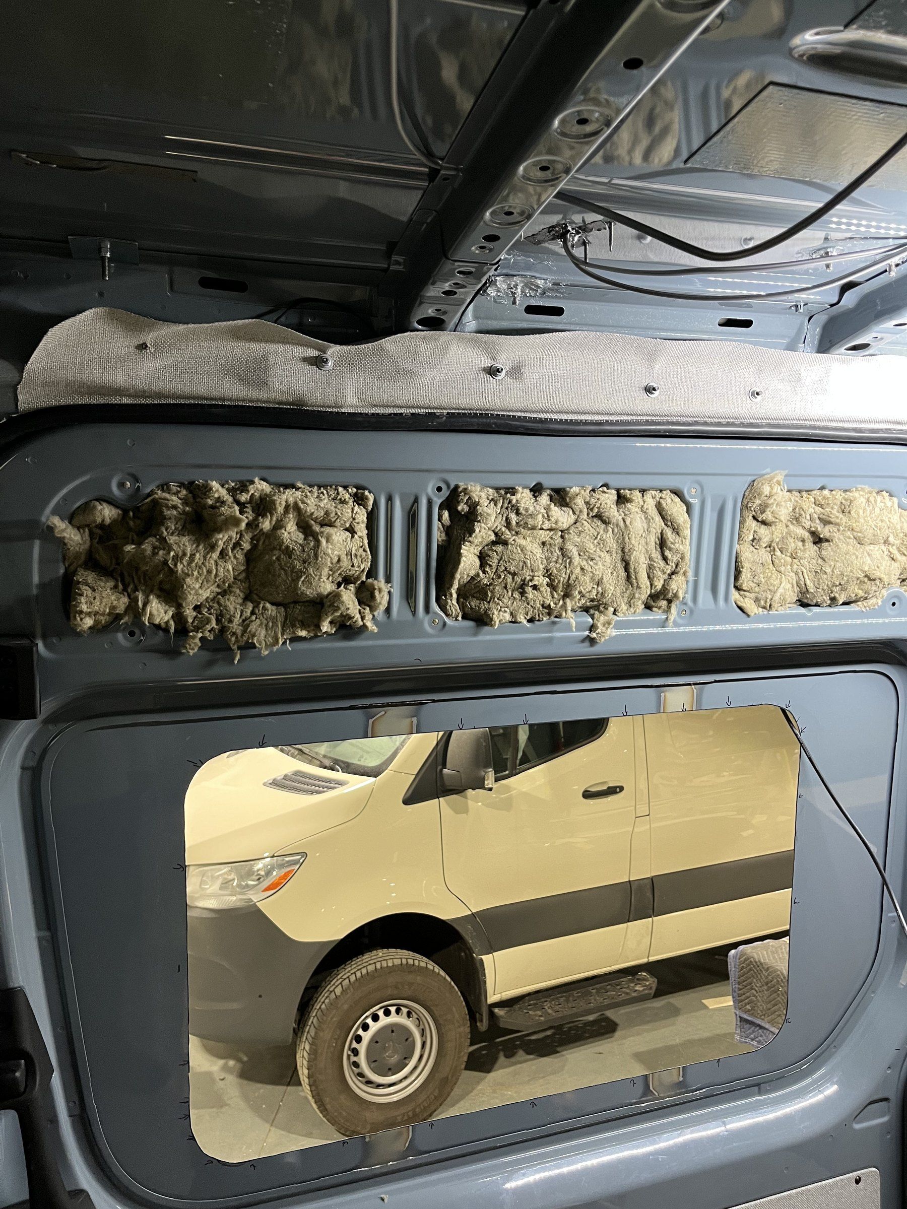 Wool insulation packed into the van walls.